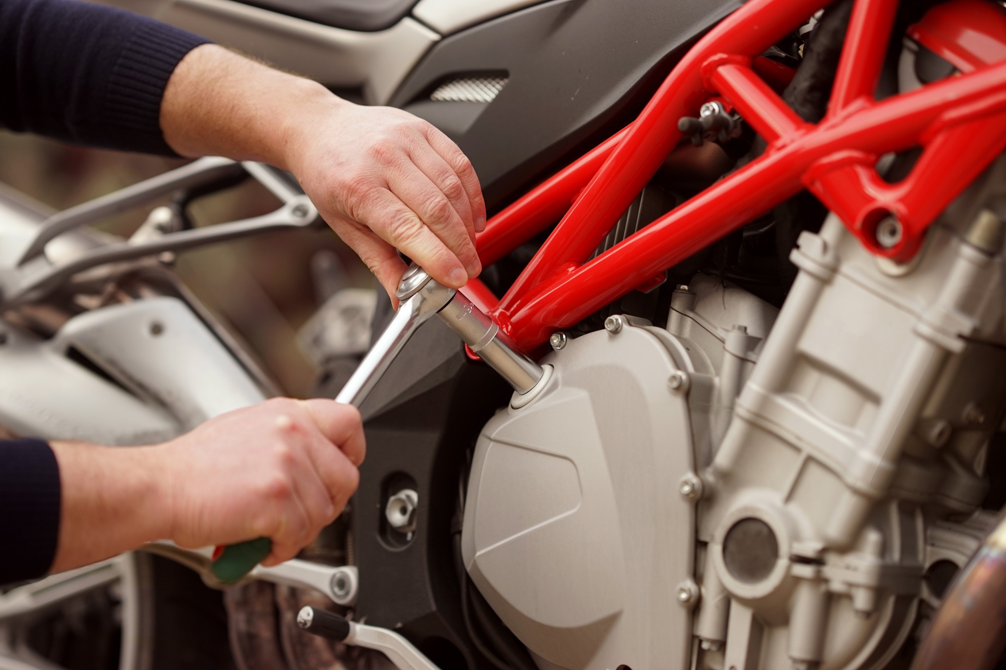 A technician repairs the motorcycle at the service